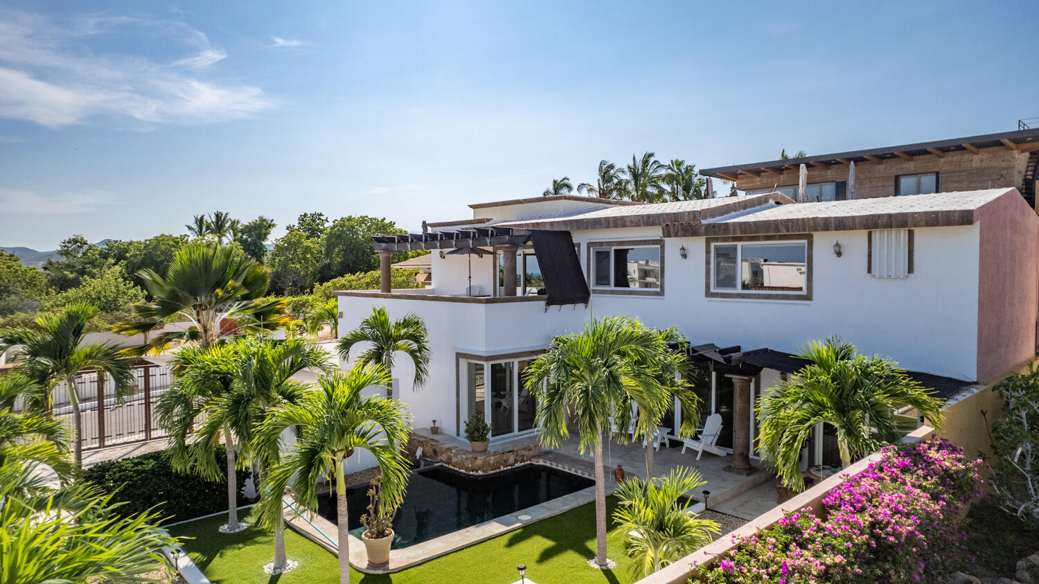 Palmilla Caleta Loma Casa Plumeria is a beautifully designed, single-level 4-bedroom hacienda-style home located within the prestigious gated community of Caleta Loma in Palmilla. Thoughtfully upgraded while preserving its authentic Mexican charm, the home features three bedrooms in the main house and a separate casita located off the courtyard, ideal for guests or added privacy.You enter the home through a beautifully landscaped courtyard, surrounded by colorful plumerias and bougainvillea that carry throughout the entire property. The landscaping creates a high level of privacy and gives the home a peaceful, tucked-away feel, while still enjoying ocean – Villas de Oro, San Jose Corridor, BS