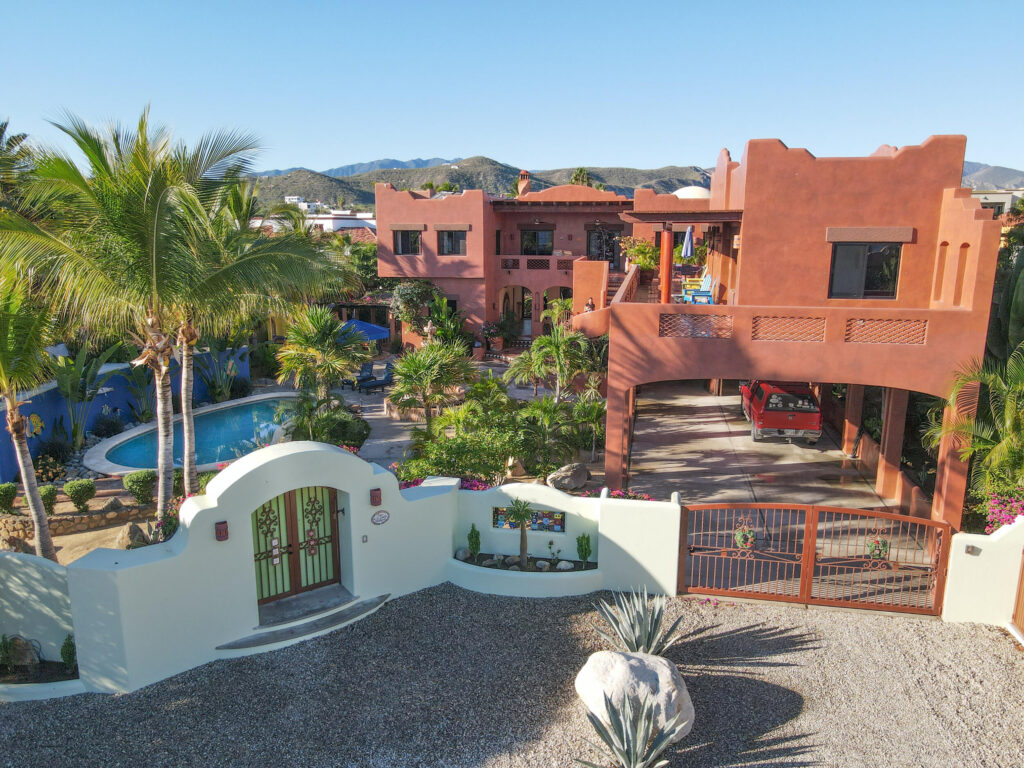 Palmilla Caleta Loma Casa Plumeria is a beautifully designed, single-level 4-bedroom hacienda-style home located within the prestigious gated community of Caleta Loma in Palmilla. Thoughtfully upgraded while preserving its authentic Mexican charm, the home features three bedrooms in the main house and a separate casita located off the courtyard, ideal for guests or added privacy.You enter the home through a beautifully landscaped courtyard, surrounded by colorful plumerias and bougainvillea that carry throughout the entire property. The landscaping creates a high level of privacy and gives the home a peaceful, tucked-away feel, while still enjoying ocean – Villas de Oro, San Jose Corridor, BS