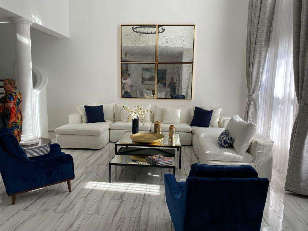 Palmilla Villas De Oro Phase 1 Villa de Oro fantastic. Number 304 is very unique as it is one of a few town homes (most are upper or lower)that has a massive dramatic two story window that lights up the home. Downstairs has the impressive living and dining room. The kitchen has a new granite counter, a breakfast area and a bar for guests to enjoy the activity in the kitchen. Outside living with a big space to dine and sit around the large stone fireplace. Upstairs there are two bedroom suites, one of which has an outside terrace to enjoy the ocean – Villas de Oro, San Jose Corridor, BS